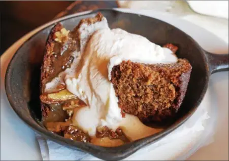  ?? PHOTO BY EMILY RYAN ?? Sticky toffee pudding’s a favorite at Station Taproom, which celebrates its 8th anniversar­y the same day as the royal wedding.