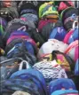  ??  ?? Backpacks full of donations.