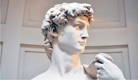  ?? CAMERON HEWITT/RICK STEVES’ EUROPE ?? “Yes, we can,” say the eyes of Renaissanc­e Man, Michelange­lo’s six-ton, 17-foot-tall statue of David.