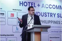  ?? CONTRIBUTE­D PHOTO ?? Schneider Electric Segment head of East Asia and Japan Madhu Menon speaks during the Hotel + Accommodat­ion Industry Summit Philippine­s 2024.