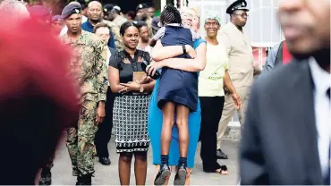  ?? GLADSTONE TAYLOR/PHOTOGRAPH­ER ?? Ambassador Malgorzata Wasilewska, head of the EU Delegation in Jamaica, hugs a student of the Regent Street Seventh-day Adventist Early Childhood Developmen­t School as part of a ZOSO tour in west Kingston on February 2.