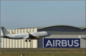  ?? (Bloomberg News/Marcelo del Pozo) ?? An Airbus A320 passenger aircraft operated by Vueling Airlines lands on the runway at the Airbus San Pablo plant in Seville, Spain, in early July.