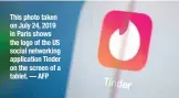  ?? — AFP ?? This photo taken on July 24, 2019 in Paris shows the logo of the US social networking applicatio­n Tinder on the screen of a tablet.