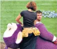  ??  ?? Simon Shelton on set as Tinky Winky during the filming of Teletubbie­s in 1997