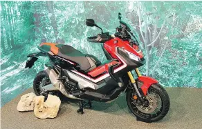  ?? PHOTOS: COSTA MOUZOURIS/ DRIVING.CA ?? The Honda X-ADV is a cross between an adventure motorcycle and a scooter, and comes with a key fob.