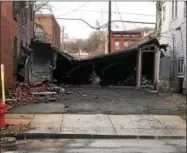  ?? NICHOLAS BUONANNO — NBUONANNO@TROYRECORD.COM ?? Marra’s Pharmacy lost around $20,000 worth of inventory after its inventory garage across from the pharmacy was destroyed in the Thursday afternoon blaze in Cohoes.