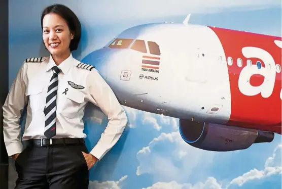  ?? — Photo: AZHAR MAHFOF/ The Star ?? Thai AirAsia’s Captain Chananporn is living her dream of being a pilot.