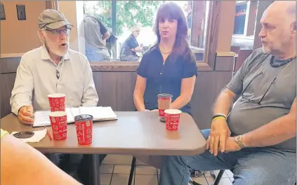  ?? JAMES MCLEOD/THE TELEGRAM ?? Former Mayor Andy Wells was seated outside Tim Hortons with friends Tuesday morning to announce he will run for mayor of St. John’s in the upcoming municipal election.