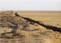  ??  ?? MOSUL: In this file photo, a long trench created by Kurdish forces to demarcate their border, is seen at an open field in the Nineveh plain, northeast of Mosul, Iraq. —AP