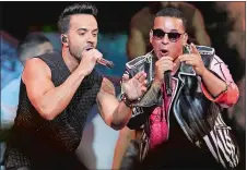  ?? LYNNE SLADKY, FILE/AP PHOTO ?? Luis Fonsi, left, and Daddy Yankee perform during the Latin Billboard Awards in April in Florida.