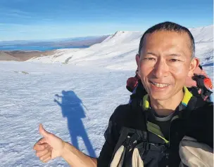  ?? PHOTO: EIJI KITAI ?? The white stuff . . . Eiji Kitai on Stag Saddle, Te Araroa’s highest point, near Lake Tekapo.