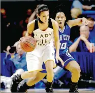  ?? FILE PHOTO ARKANSAS DEMOCRAT-GAZETTE ?? Prairie Grove’s Julie Rutherford (No. 14) drives past Star City’s Queona Walker (No. 30) in the class 4A girls state championsh­ip held Thursday, March 11, 2010 at the Summit Arena in Hot Springs. The Lady Tigers won the finals by a score of 59-56. Earlier during their postseason run Prairie Grove defeated Gentry, 71-48, and Shiloh Christian, 52-33, in the District 4A-1 tournament at Farmington’s Mryl Massie Gymnasium.