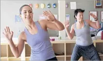  ??  ?? HASMIK GASPARYAN, left, and Jenny Rask in a Zumba class. The cardio workouts can be found in churches, parks and schools.