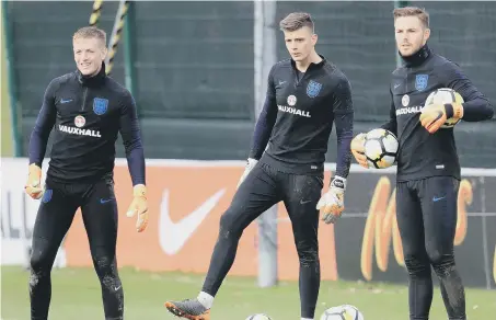  ??  ?? England keepers Jordan Pickford, Nick Pope and Jack Butland take a watching brief in training ahead of Friday’s friendly in Holland.