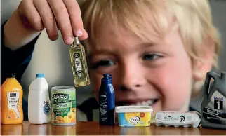  ?? PHOTO: KEVIN STENT/STUFF ?? Cameron Sigmund, 5, with collectabl­es from New World’s successful ‘‘Little Shop’’ promotion.