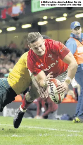  ??  ?? > Hallam Amos touched down for his late try against Australia on Saturday