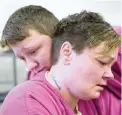  ??  ?? TRAGIC: Mary Sammons, 41, foreground, is comforted by cellmate Blanche Ball, after Sammons learnt that her son was murdered.
