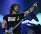  ?? Leo Correa/Associated Press ?? Dave Grohl of the band Foo Fighters performs at the Rock in Rio music festival in Rio de Janeiro, Brazil.