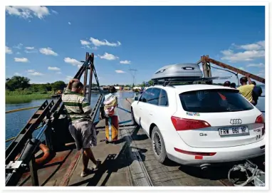  ??  ?? RIVER TIME (opposite page). Sunset over the Zambezi at Island View Lodge near Katima Mulilo in the Zambezi Region.
SLOWLY, SLOWLY (left). The biggest challenge on the holiday was crossing the Zambezi River by pont at the Kazungula border post. It took...