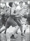  ?? NWA Democrat-Gazette/ANDY SHUPE ?? Fayettevil­le’s Caleb Finney (20) attempts to drive to the basket while Springdale High’s Carl Fitch defends Tuesday at Bulldog Arena.