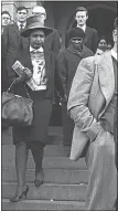  ??  ?? HISTORIC DAY: Captured by a Drum photograph­er in June 1964, Winnie Madikizela-Mandela walks down the steps of Pretoria’s Palace of Justice holding the hand of her mother-in-law, Nosekeni Fanny