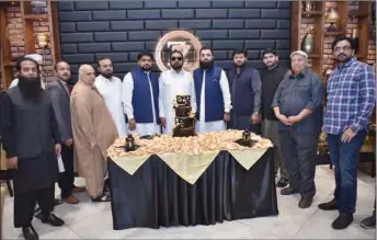  ??  ?? Jamshaid Iqbal Bhatti and his sons Zeeshan Bhatti and Farhan Bhatti and son-in-laws Adil Ashfaq, Zahid Ashraf, Shahid Ashfaq and Mohammad Rizwan with a group of guests.
