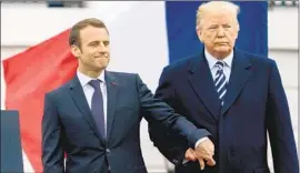  ?? Andrew Harnik Associated Press ?? FRENCH PRESIDENT Emmanuel Macron and President Trump, shown at the White House in April 2018, have agreed not to impose punitive tariffs this year.