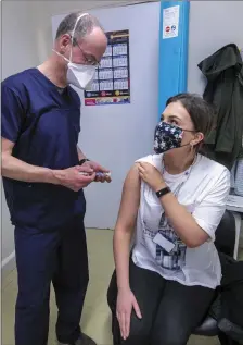  ??  ?? Dr David Wallace of Bon Secours Hospital Tralee is set to give the vaccinatio­n to colleague Katie Parnell from Tralee .