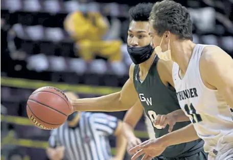  ?? Andy Cross, The Denver Post ?? George Washington’s Edward McPhee, left, drives down court against ThunderRid­ge’s Nolan Marold in the first quarter during the CHSAA Class 5A championsh­ip game at Broadmoor World Arena on Saturday night.