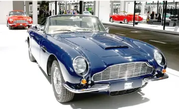  ??  ?? A 1969 Aston Martin DB6 Volante convertibl­e sports car is displayed in front of a 1966 Aston Martin DB6 (left) coupe during a media preview of the newly launched Grand Basel autoshow in Basel. — Reuters photo