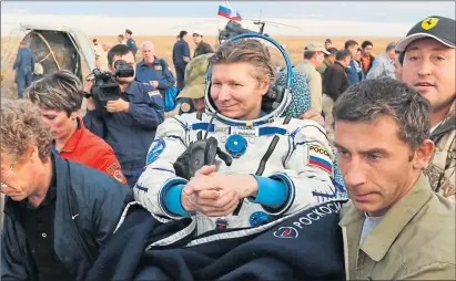  ??  ?? Internatio­nal Space Station cosmonaut Gennady Padalka arrives back on Earth in September 2015