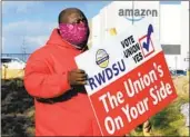  ?? JAY REEVES AP ?? Union member Michael Foster outside an Amazon facility where labor tried to organize workers.