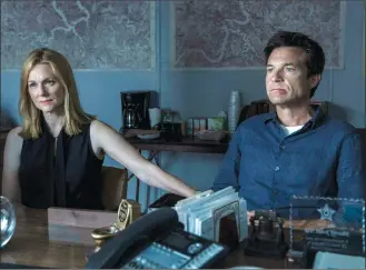  ?? Associated Press photo ?? This image released by Netflix shows Laura Linney, left, and Jason Bateman in a scene from the series, "Ozark."