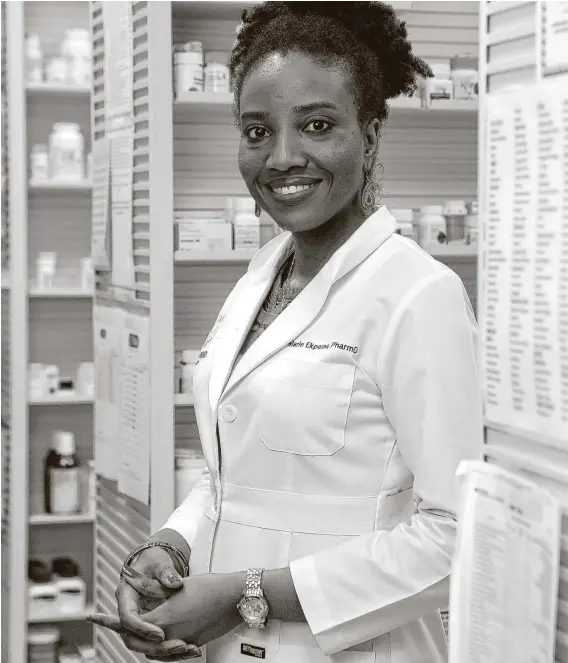  ?? Michael Wyke / Contributo­r ?? At her independen­t Summerwood Pharmacy and Compoundin­g in Humble, Marie Ekpema helped out first responders when they needed hand sanitizer.