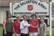  ?? SUBMITTED PHOTO ?? Lt. Rebecca Smith of the Boyertown Salvation Army (middle) accepts a donation in the amount of $7,160 from Boyertown Junior Woman’s Club members.
