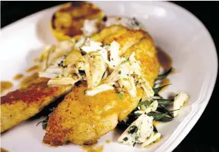  ?? Gary Coronado / Houston Chronicle ?? The Manor House’s executive chef Neal Cox’s menu includes lemon sole meuniere, jumbo lump crab, hericot verts and almond popcorn rice. This month, the exclusive restaurant on the grounds of the Houstonian Hotel, Club & Spa has decided to open to the...