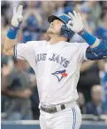  ?? FRED THORNHILL, THE CANADIAN PRESS ?? Jays third baseman Josh Donaldson celebrates his two-run homer against the Yankees in the third inning.