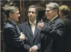  ?? DREW ANGERER/GETTY IMAGES ?? Michael Cohen of the Trump Organizati­on, centre, with retired Lt. Gen. Michael Flynn, left, and former Texas governor Rick Perry at Trump Tower in December.