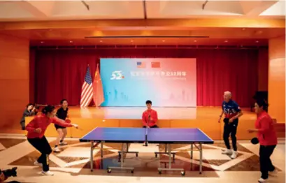  ?? ?? Chinese and
American participan­ts play table tennis at an event marking the 52nd anniversar­y of Ping-Pong Diplomacy, hosted by the Chinese Embassy in the
United States on December 13, 2023