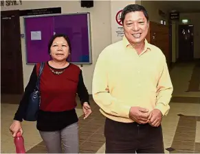  ??  ?? Relieved: Chow (right) walking out after being acquitted at the George Town Sessions Court in George Town, Penang.