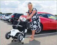  ??  ?? Fold up and go: A larger folding scooter fits in a hatchback