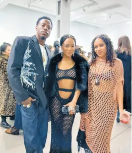  ?? ?? Dressed in Diotima, model/actress and singer Serayah (centre) and her rapper beau Joey Bada$$ joined designer Rachel Scott at her fall/winter 2024 collection presentati­on.