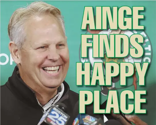  ??  ?? SEEING THE BRIGHT SIDE: Celtics president of basketball operations Danny Ainge has a laugh with the media yesterday in Waltham.