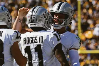  ?? Don Wright / Associated Press ?? Raiders quarterbac­k Derek Carr and wide receiver Henry Ruggs III hooked up for a late TD.