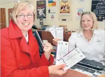  ?? Photo: JOHN HAWKINS/FAIRFAX NZ 627811948 ?? Just the ticket: Lisa Griffiths, left, and Helen Madden with tickets for the Bluff Oyster and Food Festival. Tickets for the festival are selling fast.