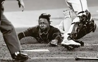  ?? Elsa / Getty Images ?? Second baseman Ozzie Albies hit .271 in an injury-shortened season and is part of a core of young Braves players who led Atlanta to its first playoff series win since 2001.