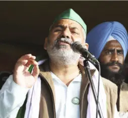  ??  ?? RAKESH TIKAIT, spokespers­on of the Bharatiya Kisan Union, addressing farmers at Ghazipur on January 28.