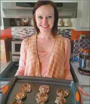  ??  ?? Emilee Atkins shows off her cooking skills with newly baked cookies, which will be offered to family and friends.