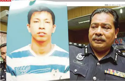  ?? FOTO: ?? IBRAHIM menunjukka­n gambar Saw yang disyaki membunuh rakan sekerjanya.