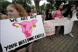  ?? CHARLIE RIEDEL — THE ASSOCIATED PRESS FILE ?? Abortion-rights advocates gather outside a the Kansas Statehouse to protest the U.S. Supreme Court's ruling on abortion, on June 24in Topeka, Kan.